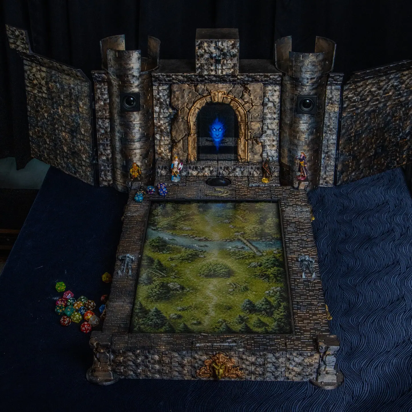 The Doungim console with a green map on the board and dice beside it